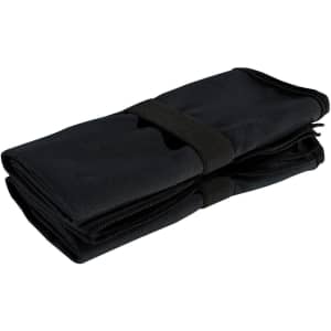 A black microfibre quick-dry fitness towel, neatly folded and secured with a strap. It features a zippered pocket.