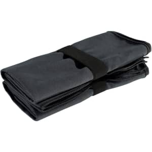A folded grey microfibre fitness towel, secured with a black strap, with a smooth texture and compact design.