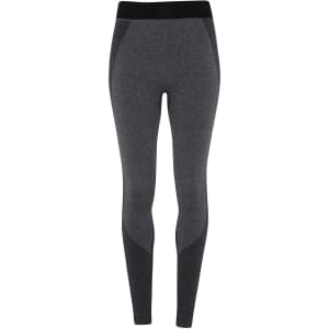 A pair of seamless, dark grey sport leggings with a black waistband, featuring a branded logo.