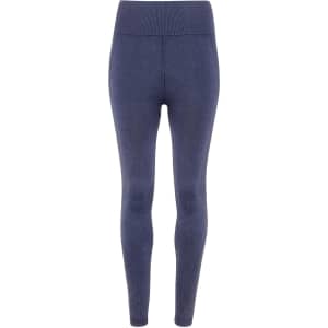 A pair of seamless leggings in a denim look, featuring a high waist and a dark blue colour.
