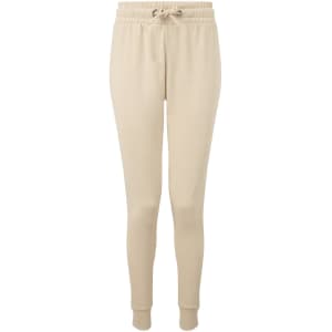 Fitted joggers in a light beige colour, featuring an elastic waistband and cuffed ankles. Includes a logo.