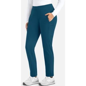 A pair of women's mid-rise tapered pants in teal, featuring side pockets and a logo on the fabric.