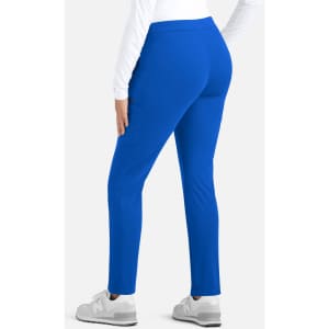 A pair of women's mid-rise tapered pants in bright blue, featuring a simple design and a branded logo.