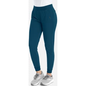 A pair of mid-rise elastic joggers in a teal colour, featuring a fitted design and ankle cuffs.