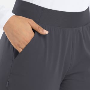 A pair of women's mid-rise joggers in dark grey, featuring an elastic waistband and side pockets.