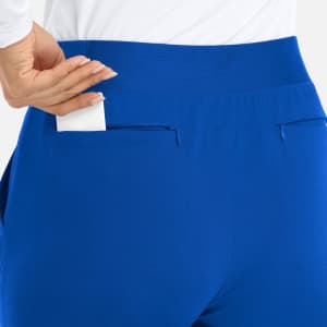A pair of blue mid-rise elastic joggers featuring a back pocket and a smooth waistband.