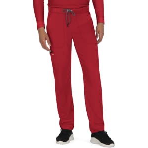 A pair of red pants with a drawstring waist and multiple pockets. The model is wearing black shoes.