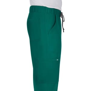 A pair of teal pants with an elastic waistband and side pockets. The fabric appears soft and casual.