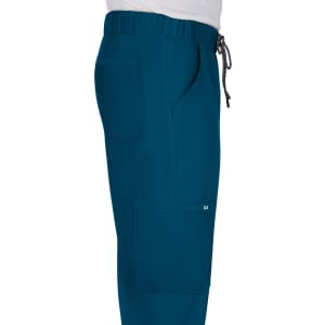 A pair of teal pants with multiple pockets and an elastic waistband, featuring a logo on the side.