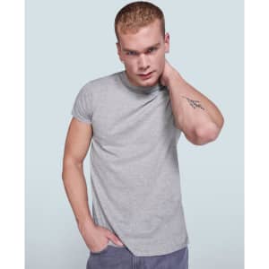 A grey T-shirt on a model with short hair, featuring a logo and casual fit.