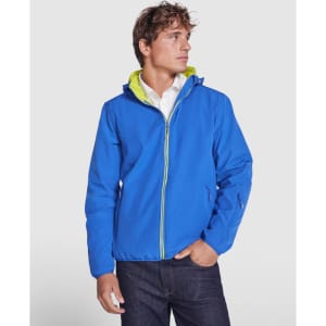 A blue unisex softshell jacket features a hood and a bright green interior, with a logo on the side.