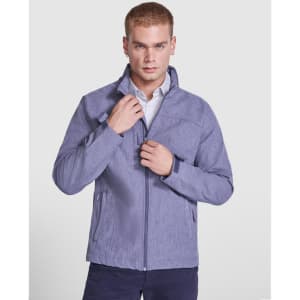 A softshell jacket in a light blue hue, featuring a zipped front and a stand-up collar, worn by a model.