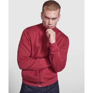 A red sweatshirt worn by a model with a high collar and zip closure. The model has a thoughtful pose.