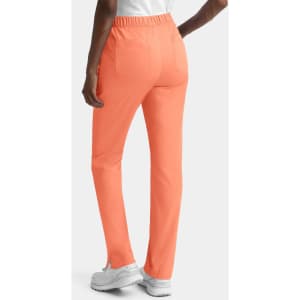 Women's cargo pants featuring a full elastic waistband in a vibrant coral colour, with back pockets and a fitted silhouette.