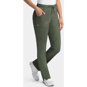 A pair of women's cargo pants in olive green with an elastic waistband and pockets, paired with white shoes.