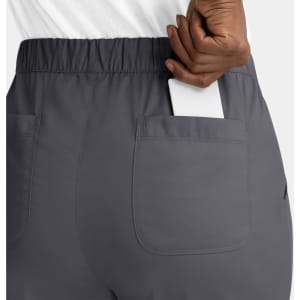 A pair of grey cargo pants with an elastic waistband, featuring a back pocket holding a phone.