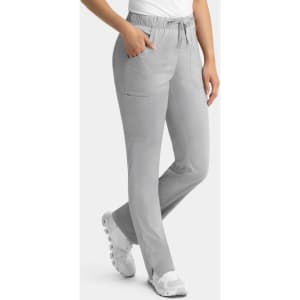 Grey women's cargo pants with a full elastic waistband and pockets, paired with white footwear.
