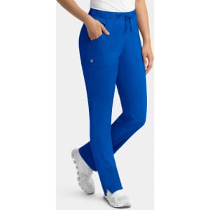 A pair of blue cargo pants featuring a full elastic waistband and pockets, worn by a model.