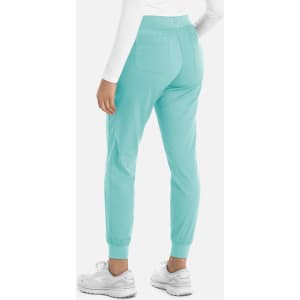 A pair of women's jogger pants in a light turquoise colour with cuffed ankles and two back pockets.