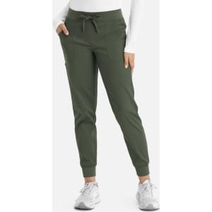 A pair of olive green jogger pants with a tapered fit, featuring pockets and a drawstring waist.