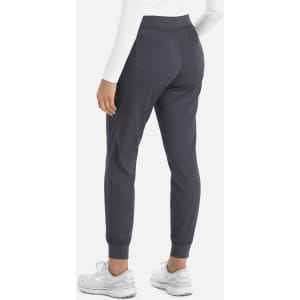 A pair of grey women's joggers with a fitted waistband and cuffed ankles, featuring a logo.