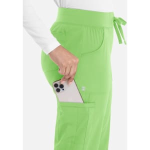 A pair of women's joggers in bright green, featuring side pockets and a drawstring waistband, with a phone tucked inside.
