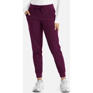 A pair of women's joggers in a rich plum colour, featuring a tie waist and fitted cuffs.
