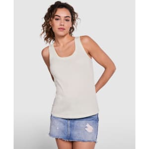 A light cream tank top displayed on a model paired with a denim skirt. The top features a simple design and has a logo.