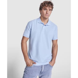 A man wearing a light blue polo shirt with a collar and short sleeves, featuring a logo.