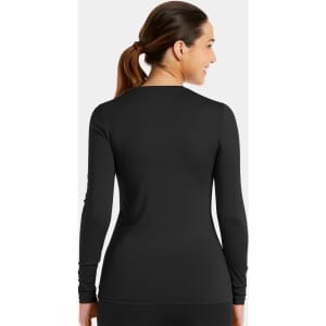 A woman wearing a black long-sleeve underscrub tee, viewed from the back. The shirt features a fitted design.
