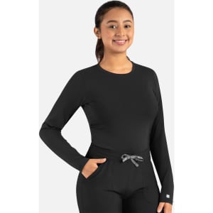 A long-sleeve black underscrub tee with a round neckline, featuring a logo and paired with dark pants.