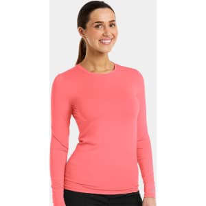 A long-sleeved tee in coral pink, featuring a fitted design and a branding logo.