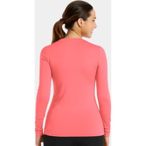 A long-sleeved underscrub tee in vibrant coral pink, featuring a simple design and a branding logo on the back.