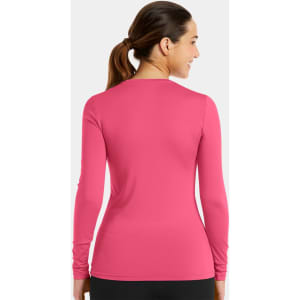 A long-sleeve underscrub tee in vibrant pink, featuring a fitted silhouette and a subtle brand logo.