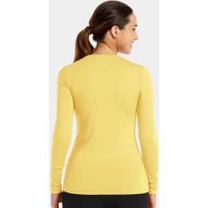 A long-sleeve underscrub tee in vibrant yellow, featuring a fitted silhouette and a logo on the back.