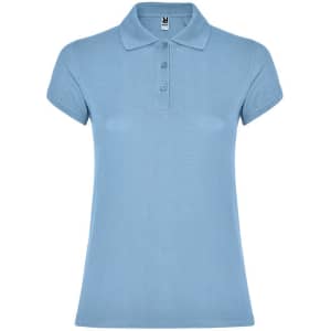 A light blue women's polo shirt featuring a collared neck and three-button placket. It has a small logo on the side.