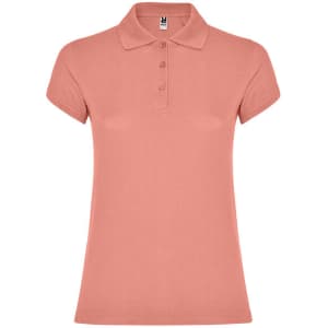 A women's polo shirt in coral pink with a classic collar and three buttons. It features a logo on the label.
