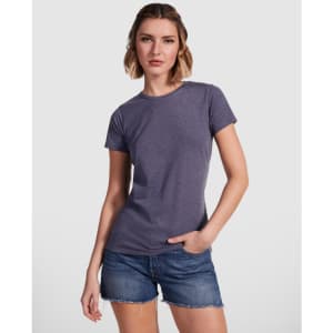 A women's t-shirt in a purple hue, paired with denim shorts. The shirt features a classic fit and a branding logo.
