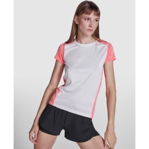 A women's T-shirt featuring a white body with coral accents, paired with black shorts. Includes a logo.