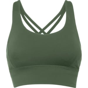 A green cropped tank top with criss-cross straps at the back and a smooth finish. It has a simple design and branding.