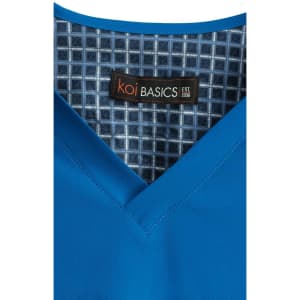 A blue V-neck top with a patterned inner lining and a label featuring a logo.