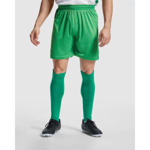 Green sports shorts paired with matching knee-length socks and black football boots, featuring a waistband for comfort.