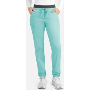 A pair of women's cargo pants in a mint green colour with a contrasting black waistband and pockets.