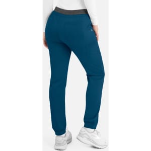 A pair of women's cargo pants in teal with a contrast waistband, featuring pockets and a logo.