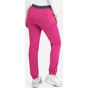 Bright pink women's cargo pants with a contrasting waistband, featuring side pockets and elastic cuffs.