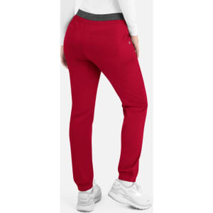Red cargo pants with a contrast elastic waistband and pockets, featuring a logo.