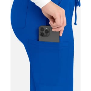A blue cargo pant featuring a hand placing a smartphone in a side pocket. The pant has an elastic waistband.