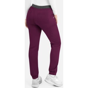 A pair of women's cargo pants in maroon with an elastic waistband and side pockets, featuring a branding logo.