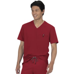 A red scrub top featuring a V-neck and a chest pocket, with drawstring trousers in a matching colour.