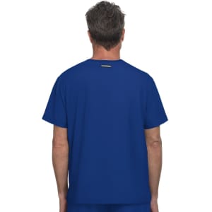 A blue t-shirt is displayed, featuring a plain back with a small logo at the top.